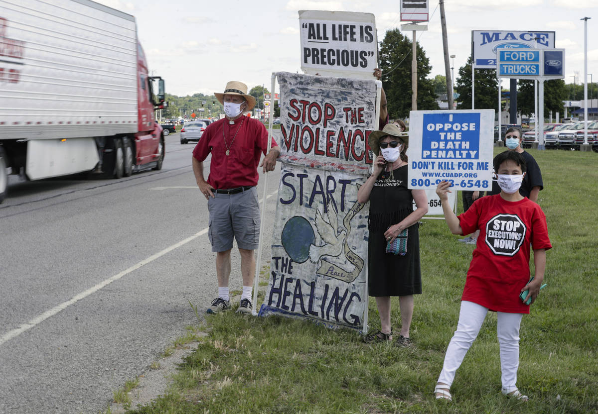 Protesters against the death penalty gather in Terre Haute, Ind., Monday, July 13, 2020. Daniel ...