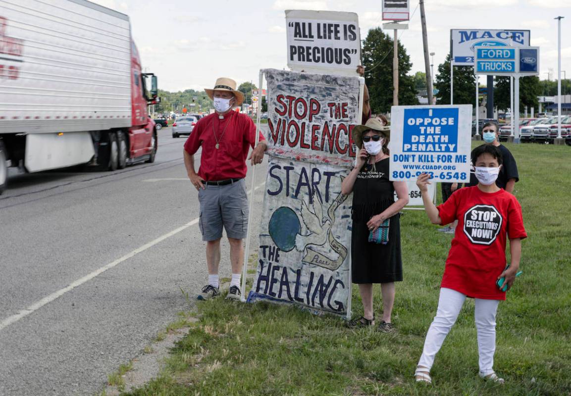 Protesters against the death penalty gather in Terre Haute, Ind., Monday, July 13, 2020. Daniel ...