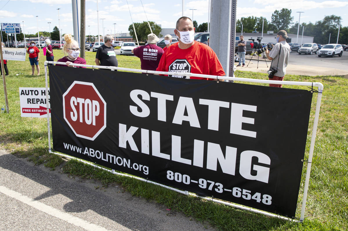 Protesters against the death penalty gather in Terre Haute, Ind., Monday, July 13, 2020. Daniel ...