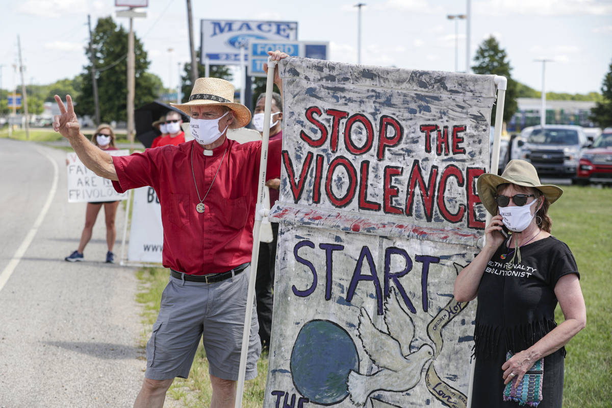 Protesters against the death penalty gather in Terre Haute, Ind., Monday, July 13, 2020. Daniel ...
