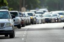 People wait in their vehicles in line at a COVID-19 testing site, Tuesday, July 14, 2020, in Ho ...