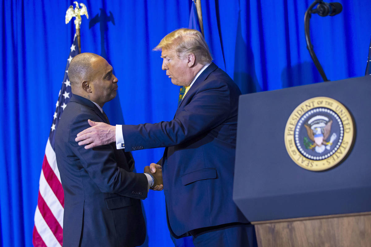 President Donald Trump, right, talks with Hope for Prisoners CEO Jon Ponder during a graduation ...