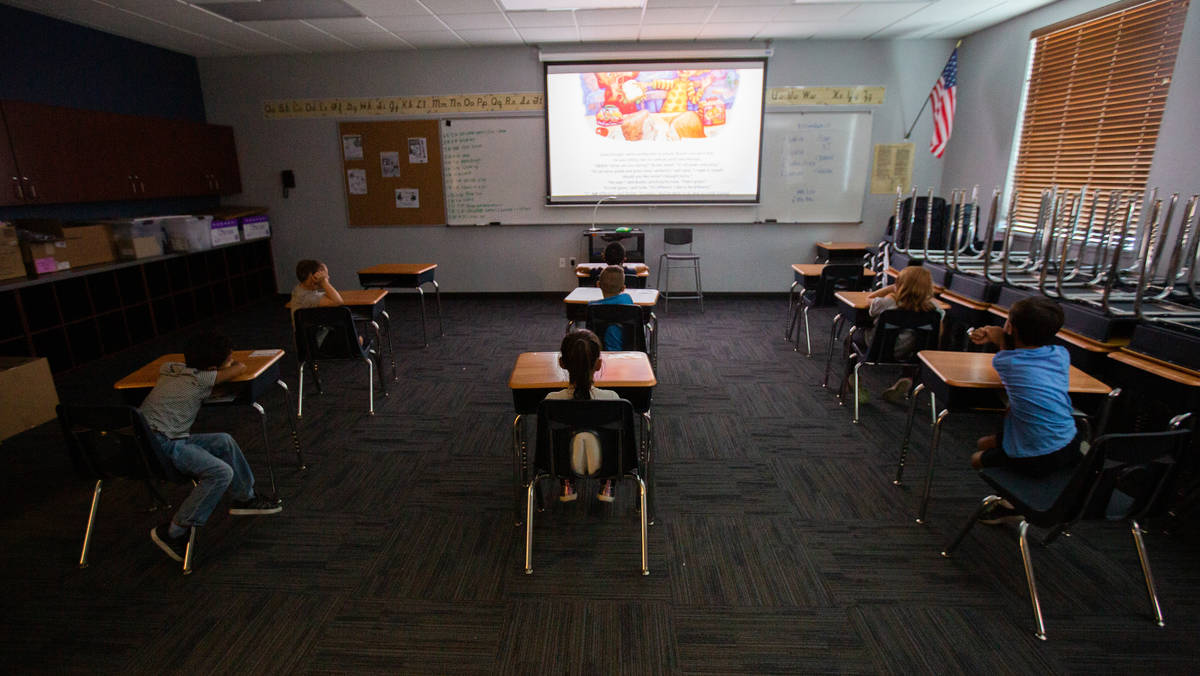 Children watch a video during a summer camp at Legacy Traditional School in Las Vegas on Thursd ...