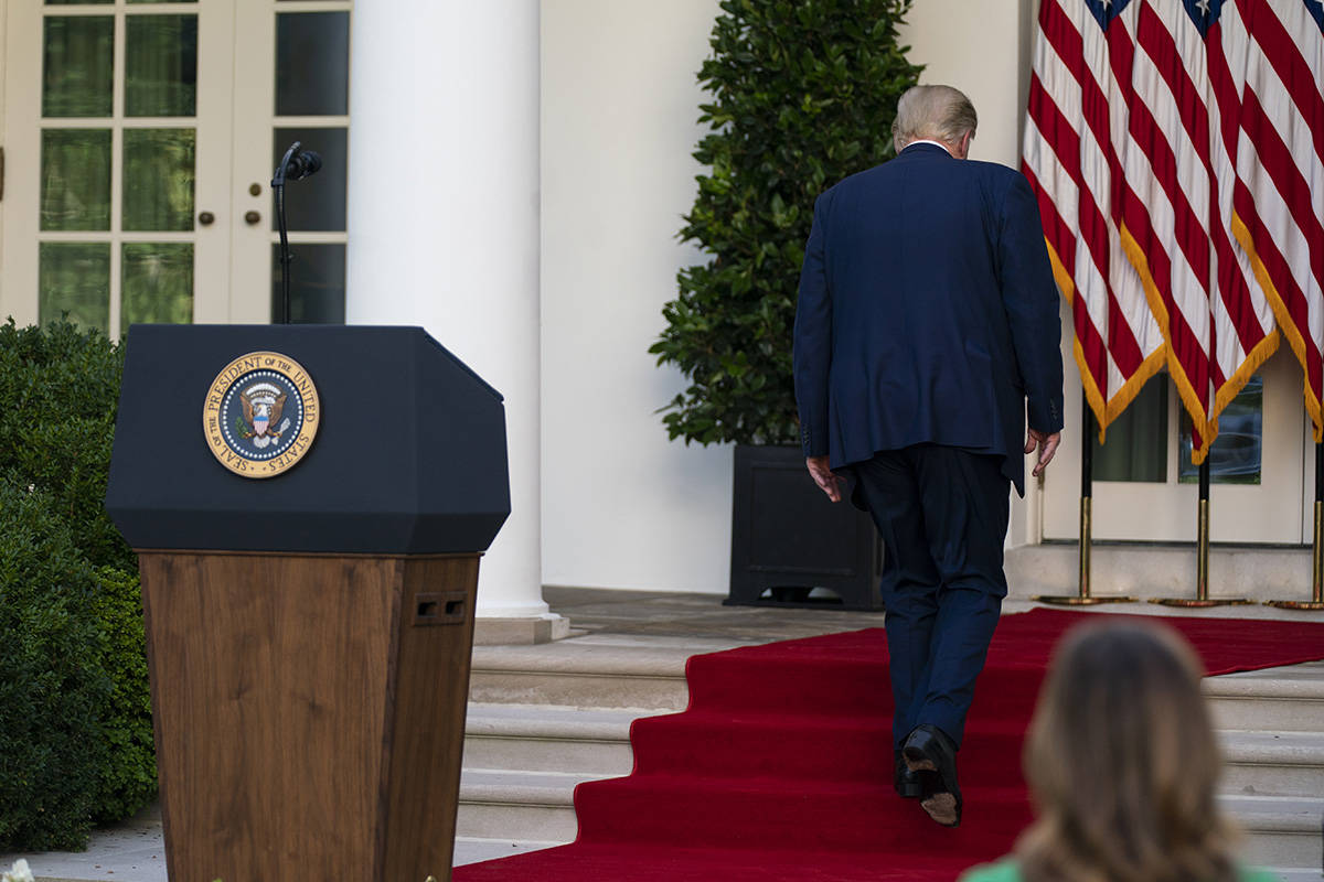 President Donald Trump walks off after speaking during a news conference in the Rose Garden of ...