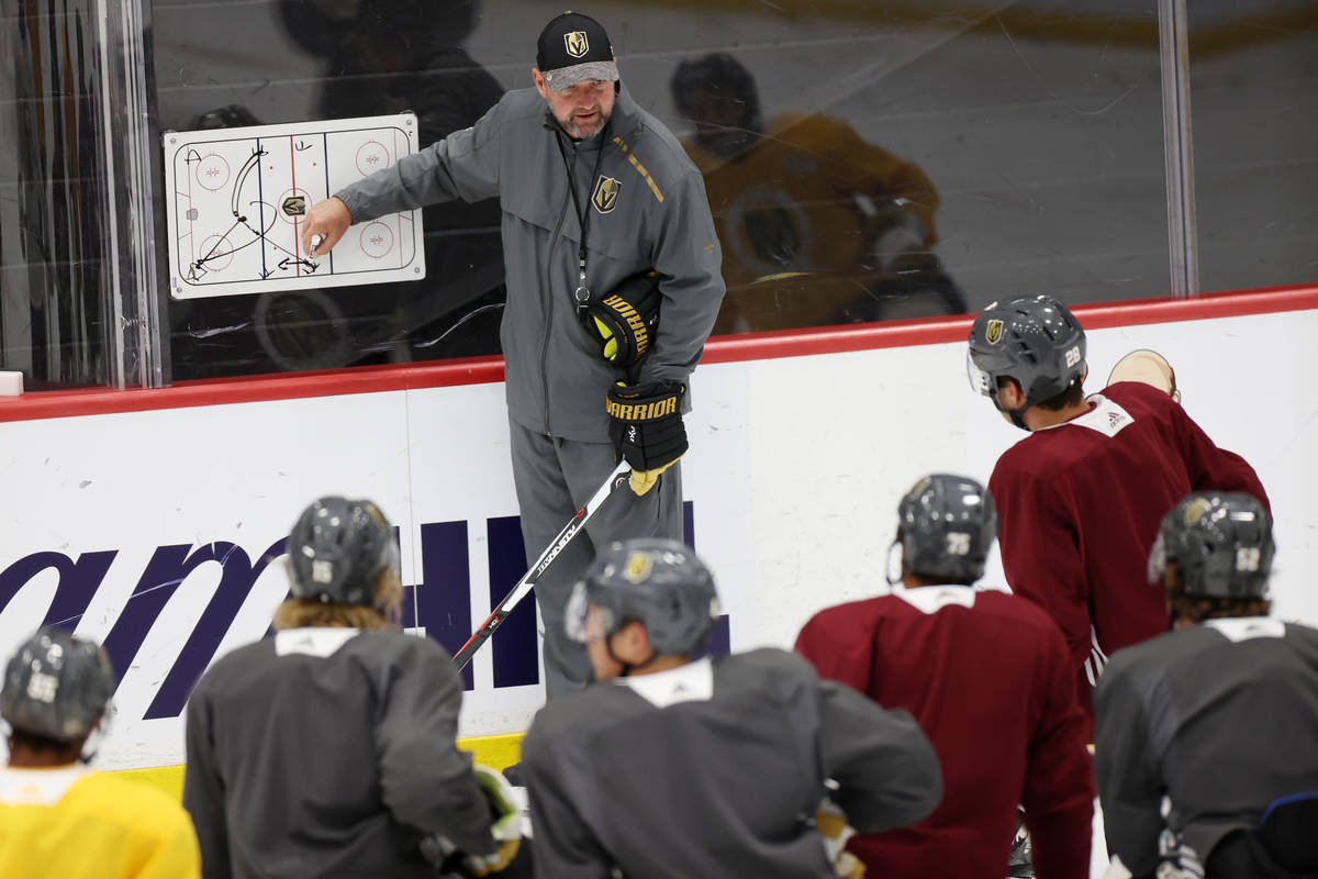 Vegas Golden Knights head coach Peter DeBoer discusses a play during a team practice at City Na ...