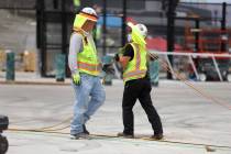 Workers deal with the heat Saturday, July 11, 2020, at Allegiant Stadium in Las Vegas. (Erik Ve ...