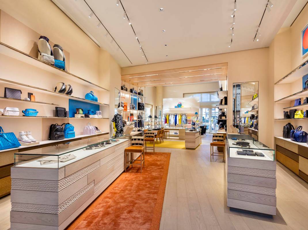 The store features floor to ceiling windows, leather shelves, wood ceilings and a unique design ...