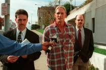 In a 1998 photo, Wesley Ira Purkey, center, is escorted by police officers in Kansas City, Kan. ...