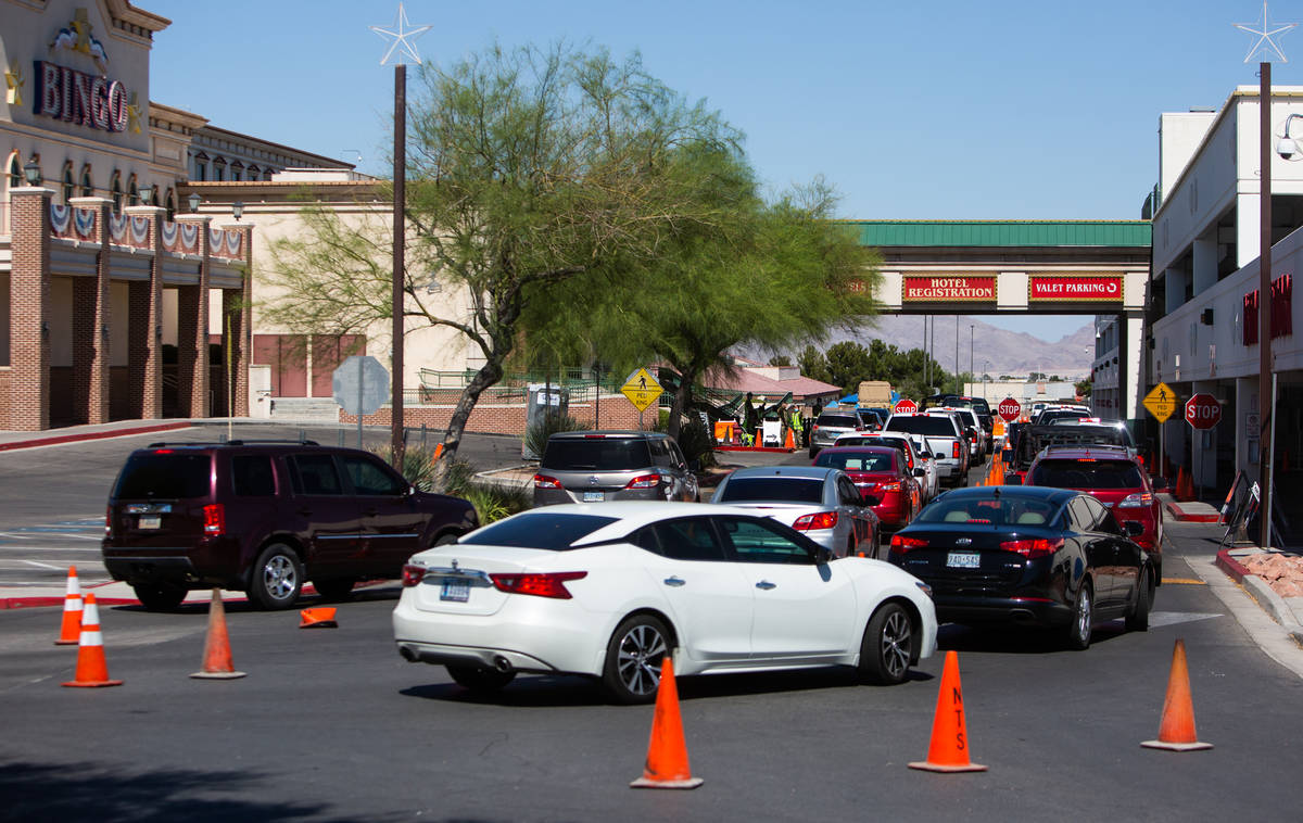 People line up for a coronavirus testing site at Texas Station in Las Vegas on Thursday, July 1 ...