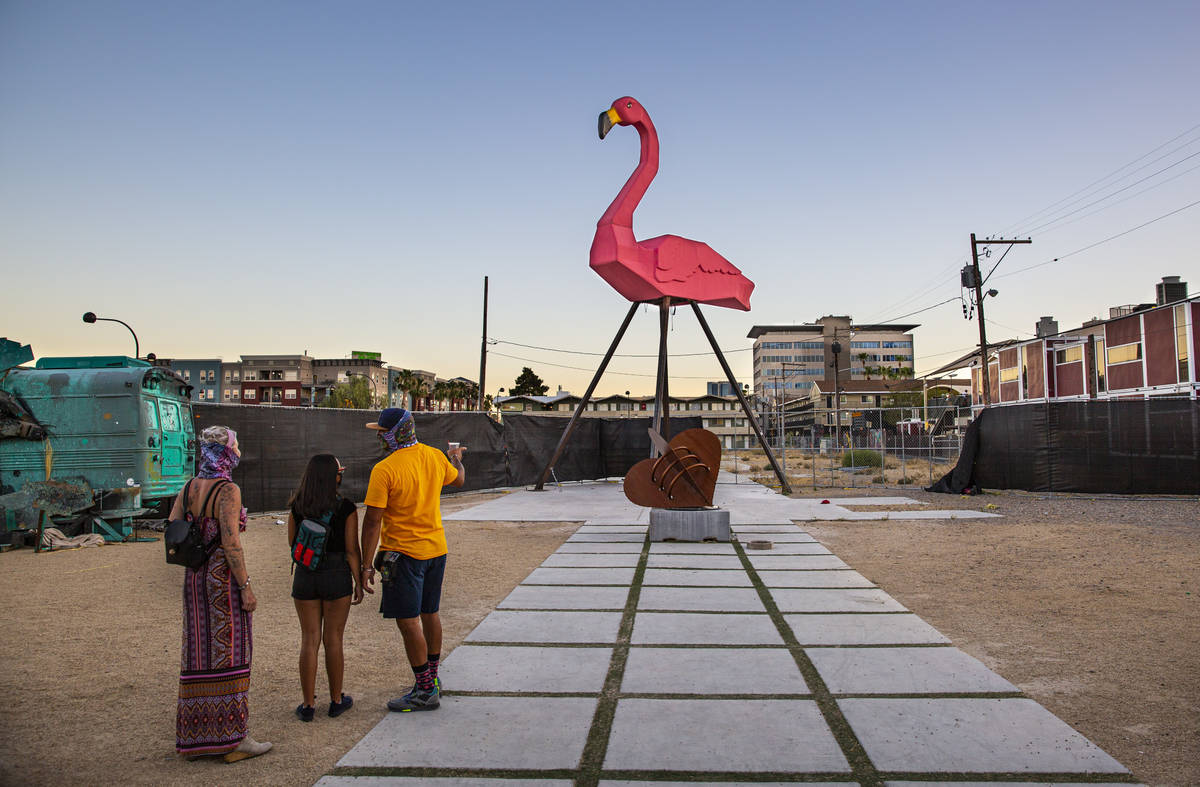 People look at Phoenicopterus Rex, a giant replica of a pink plastic lawn flamingo standing 40 ...