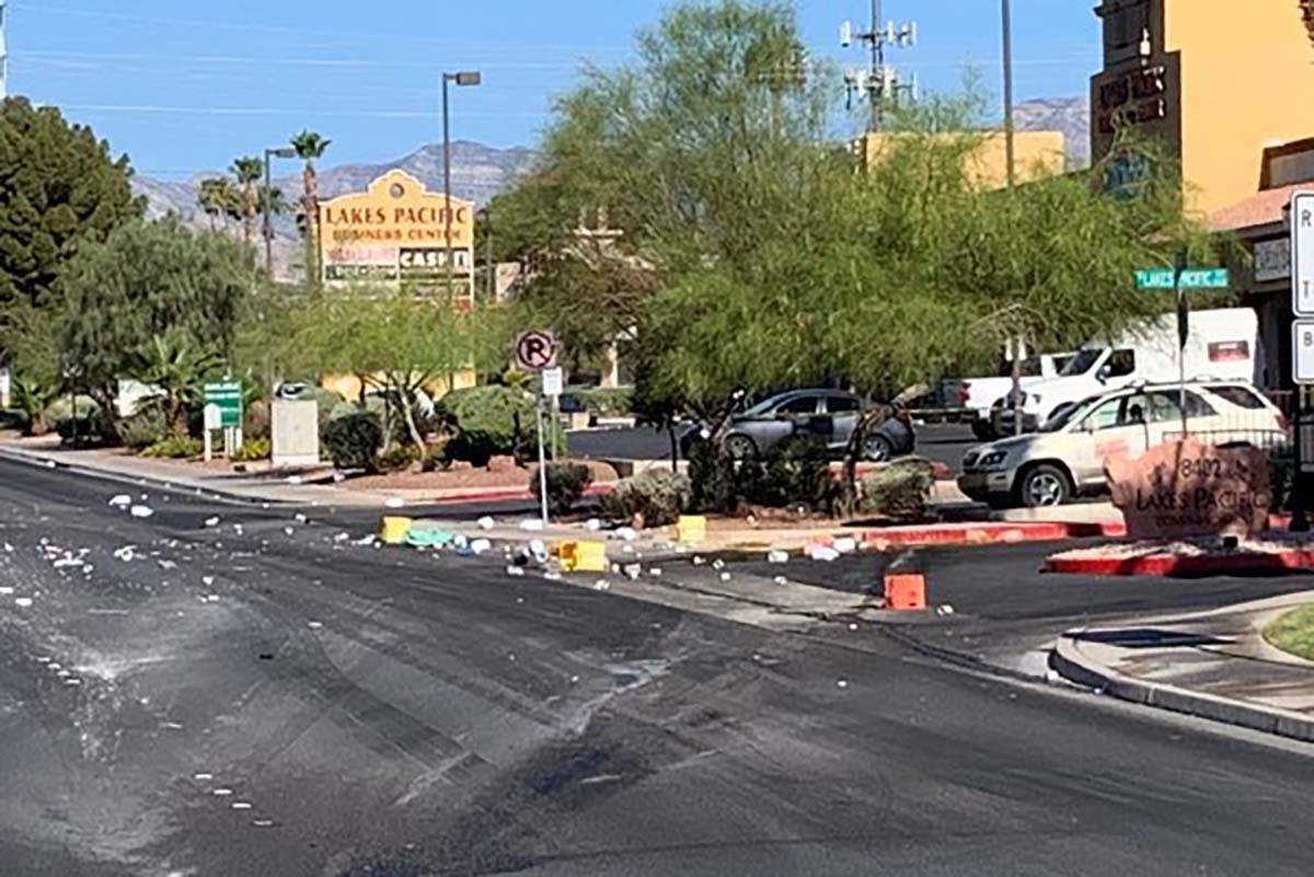 A truck transporting swimming pool chemicals overturned along West Sahara Avenue, between Duran ...
