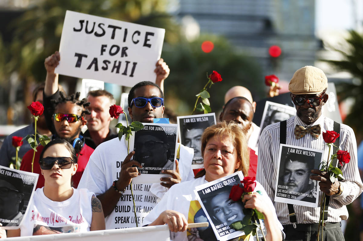Attendees march towards the Venetian during a vigil for Tashii Brown, who died in Metropolitan ...