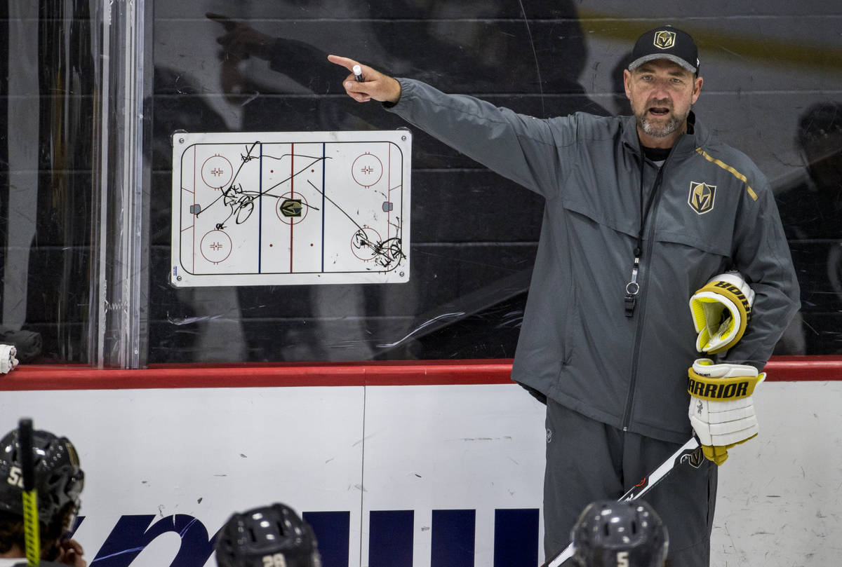 Vegas Golden Knights head coach Peter DeBoer instructs players on a formation during practice a ...