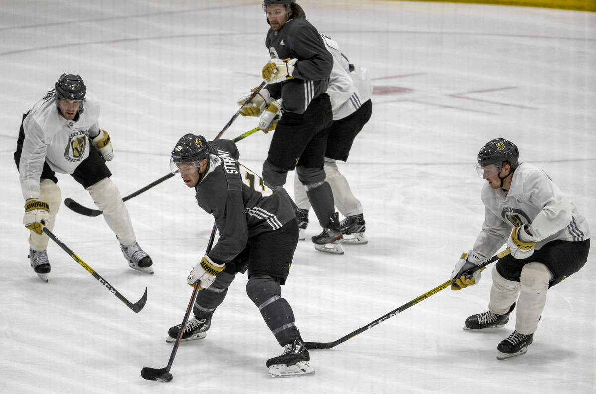 Vegas Golden Knights forward Patrick Brown (38), right, moves in on forward Paul Stastny (26), ...