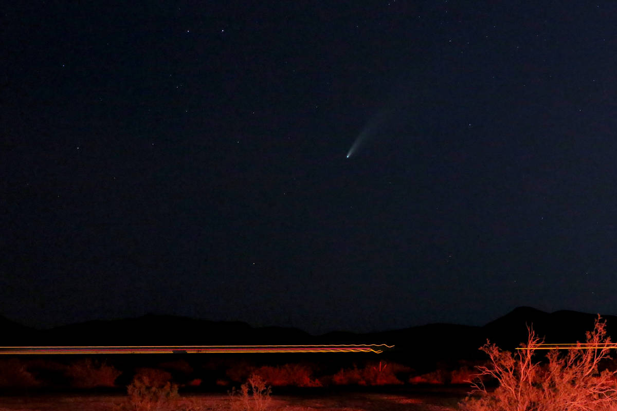 The 3-mile-wide Comet NEOWISE appears between just above the horizon and Interstate 15 in the e ...