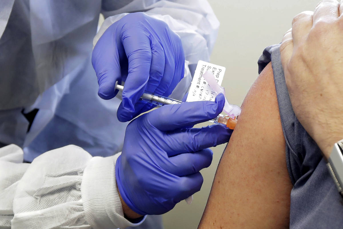 In this March 16, 2020, file photo, a subject receives a shot in the first-stage safety study c ...