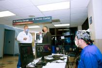 University Medical Center CEO Mason VanHouweling, center, discusses the hospital's patient volu ...