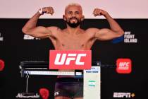 Deiveson Figueiredo of Brazil poses on the scale during the UFC Fight Night weigh-in inside Fla ...