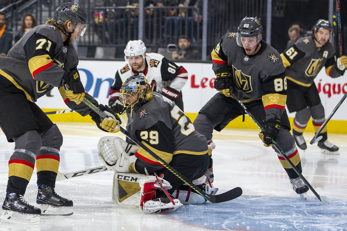 Vegas Golden Knights goaltender Marc-Andre Fleury (29, center) stops a power-play shot on goal ...