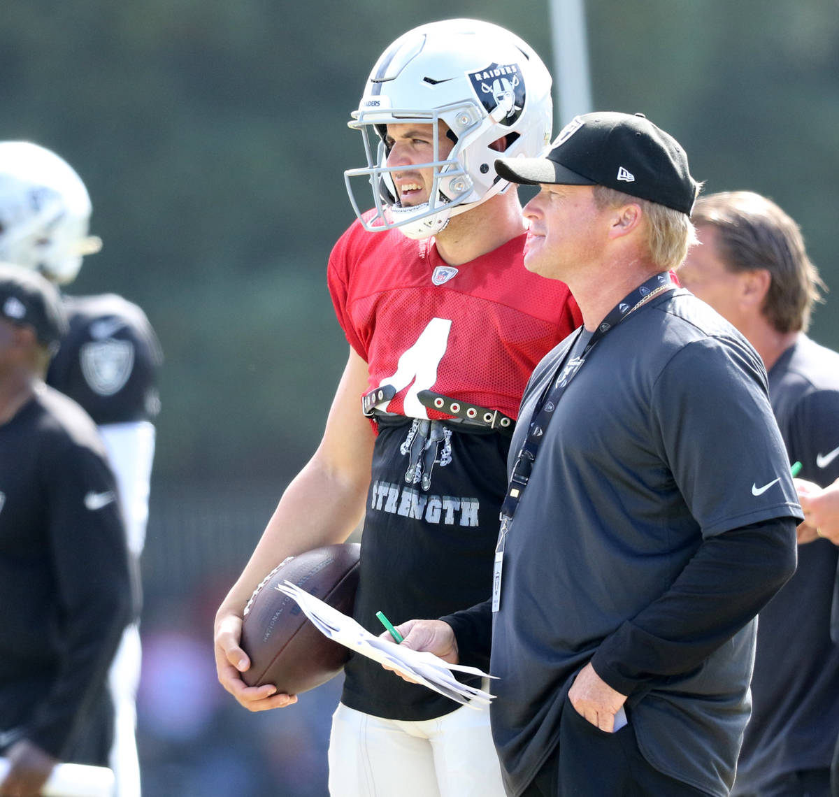 Oakland Raiders quarterback Derek Carr (4) and head coach Jon Gruden watch the offense run a pl ...