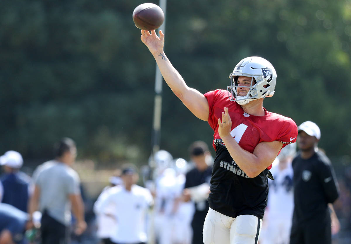 Oakland Raiders quarterback Derek Carr (4) throws the football during the NFL team's joint trai ...