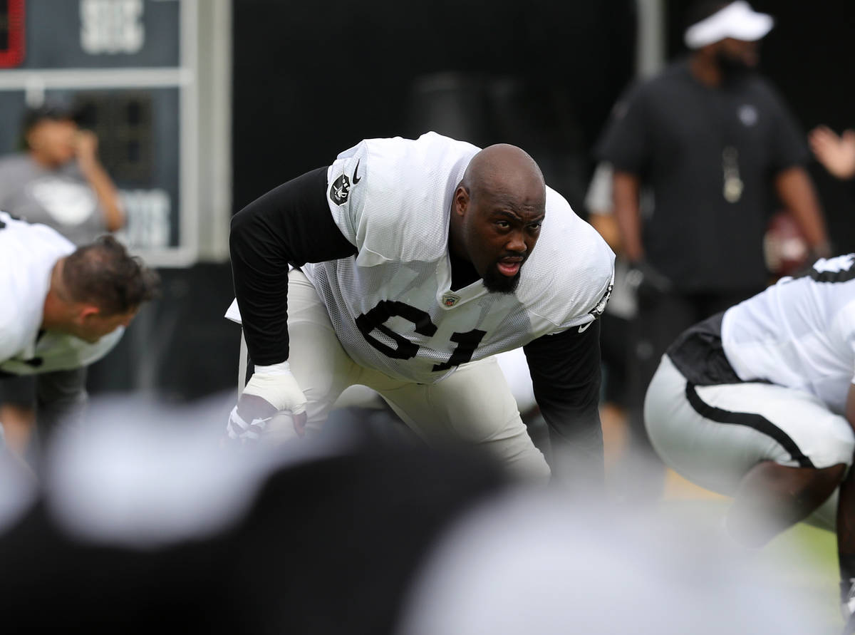 Oakland Raiders center Rodney Hudson (61) stretches during the NFL team's training camp in Napa ...