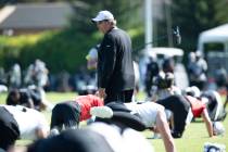 Oakland Raiders senior defensive assistant Mike Trgovac walks through the stretching period dur ...