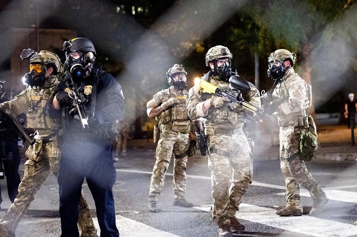 Federal agents disperse Black Lives Matter protesters near the Mark O. Hatfield United States C ...