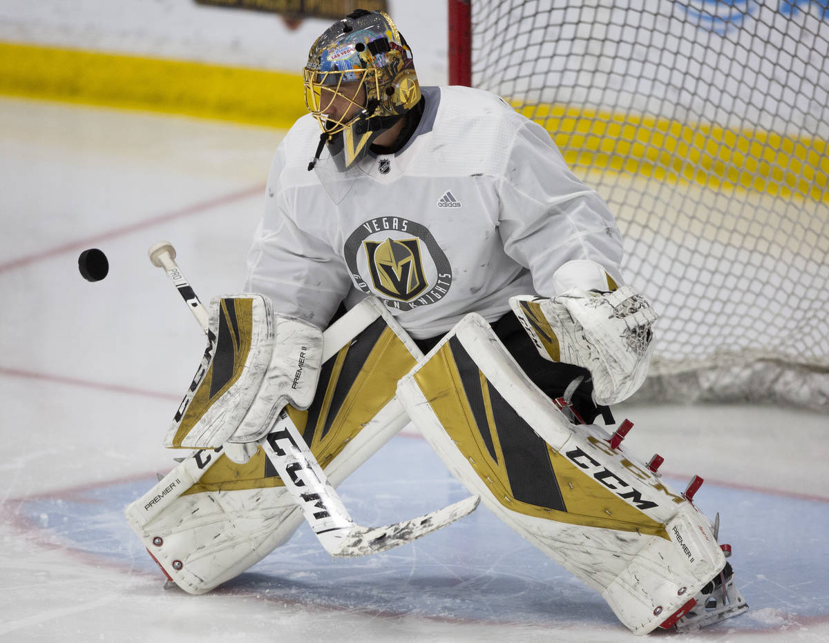 Golden Knights' goaltender Marc-Andre Fleury (29) eyes the puck before making a save during pra ...