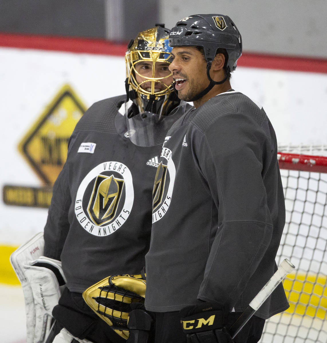 Golden Knights' goaltender Marc-Andre Fleury (29) and forward Ryan Reaves (75) chat during prac ...