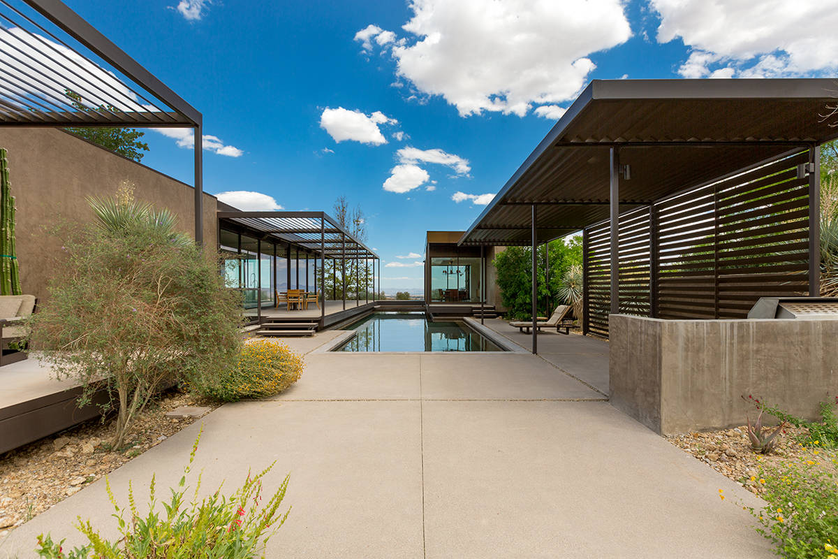 The home at 7 Painted Feather Way was created by world-renowned architecture firm Marmol Radzin ...