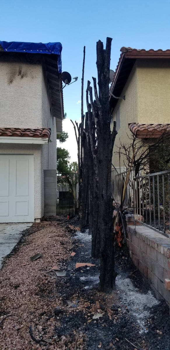 Damage is seen from a fire that started outside a home on the 8600 block of Catalonia Drive in ...