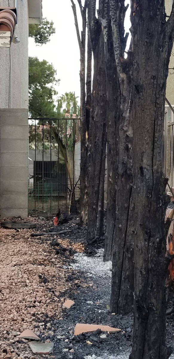 Damage is seen from a fire that started outside a home on the 8600 block of Catalonia Drive in ...