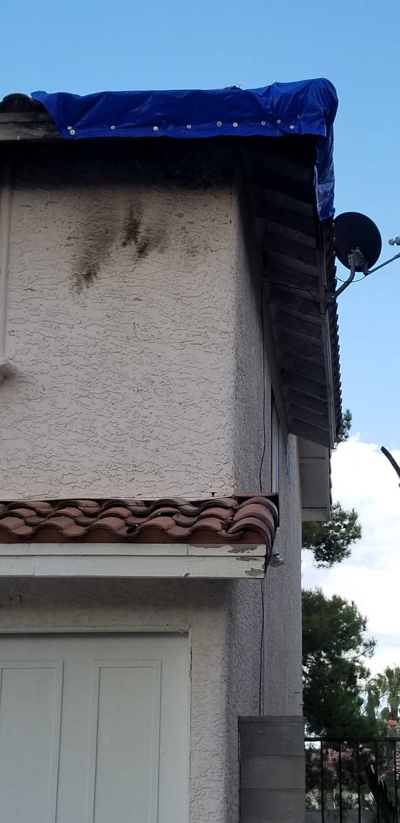 Damage is seen from a fire that started outside a home on the 8600 block of Catalonia Drive in ...