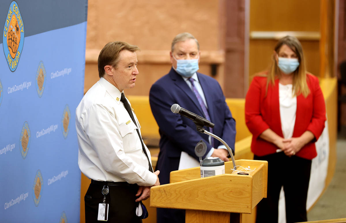 Clark County Fire Chief John Steinbeck, from left, Dr. Michael Johnson, director of the Communi ...