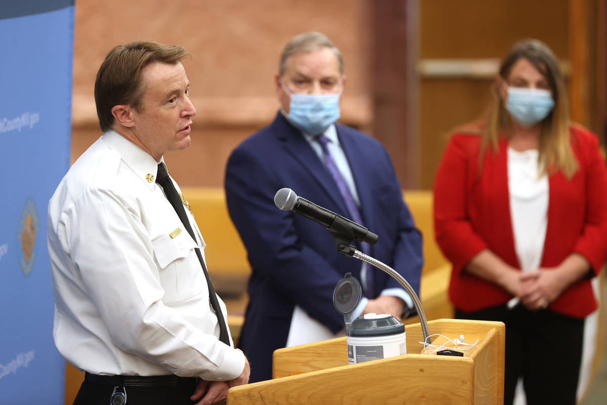 Clark County Fire Chief John Steinbeck, from left, Dr. Michael Johnson, director of the Communi ...