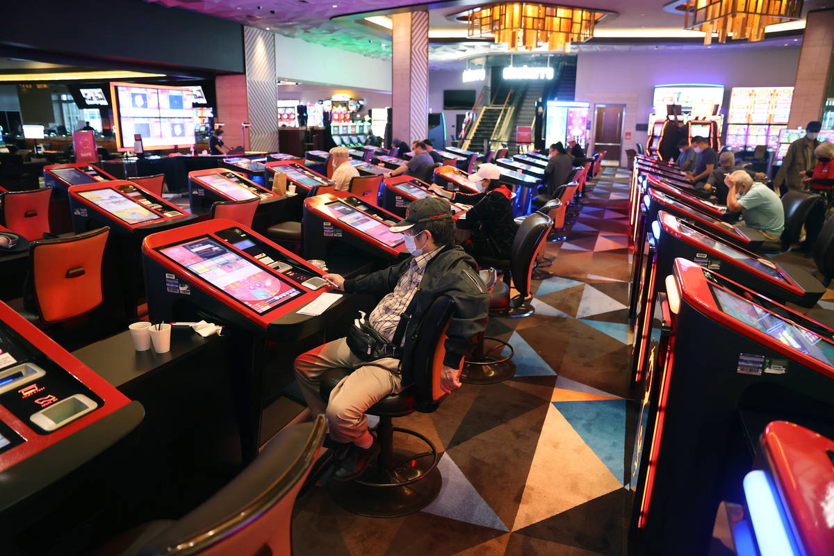 Customers play with digital baccarat gaming tables at Palace Station Casino in Las Vegas, Frida ...