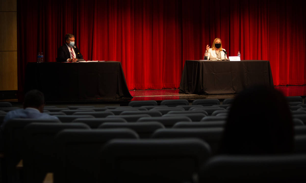 Tod Fitzpatrick, left, senior advisor to the president, listens as Karla Leeper, executive vice ...