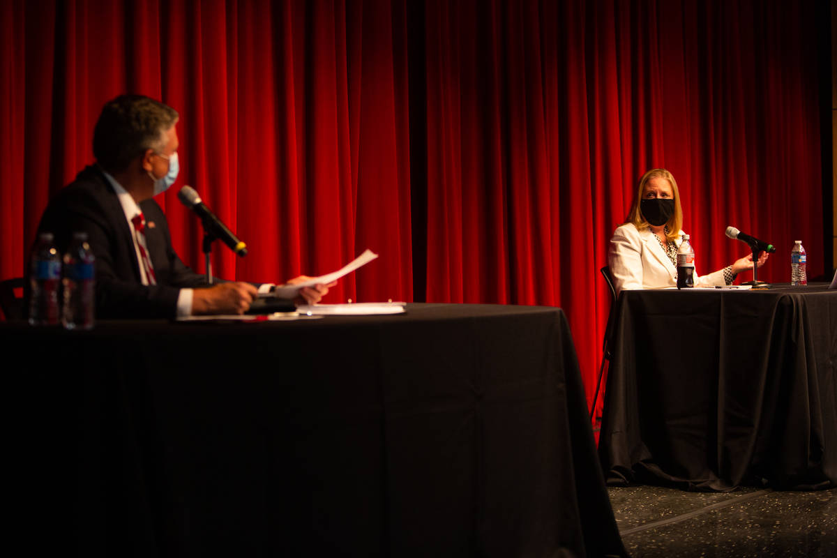Tod Fitzpatrick, left, senior advisor to the president, listens as Karla Leeper, executive vice ...