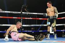 Oscar Valdez, right, knocks down Jayson Velez during their junior lightweight fight on Tuesday, ...