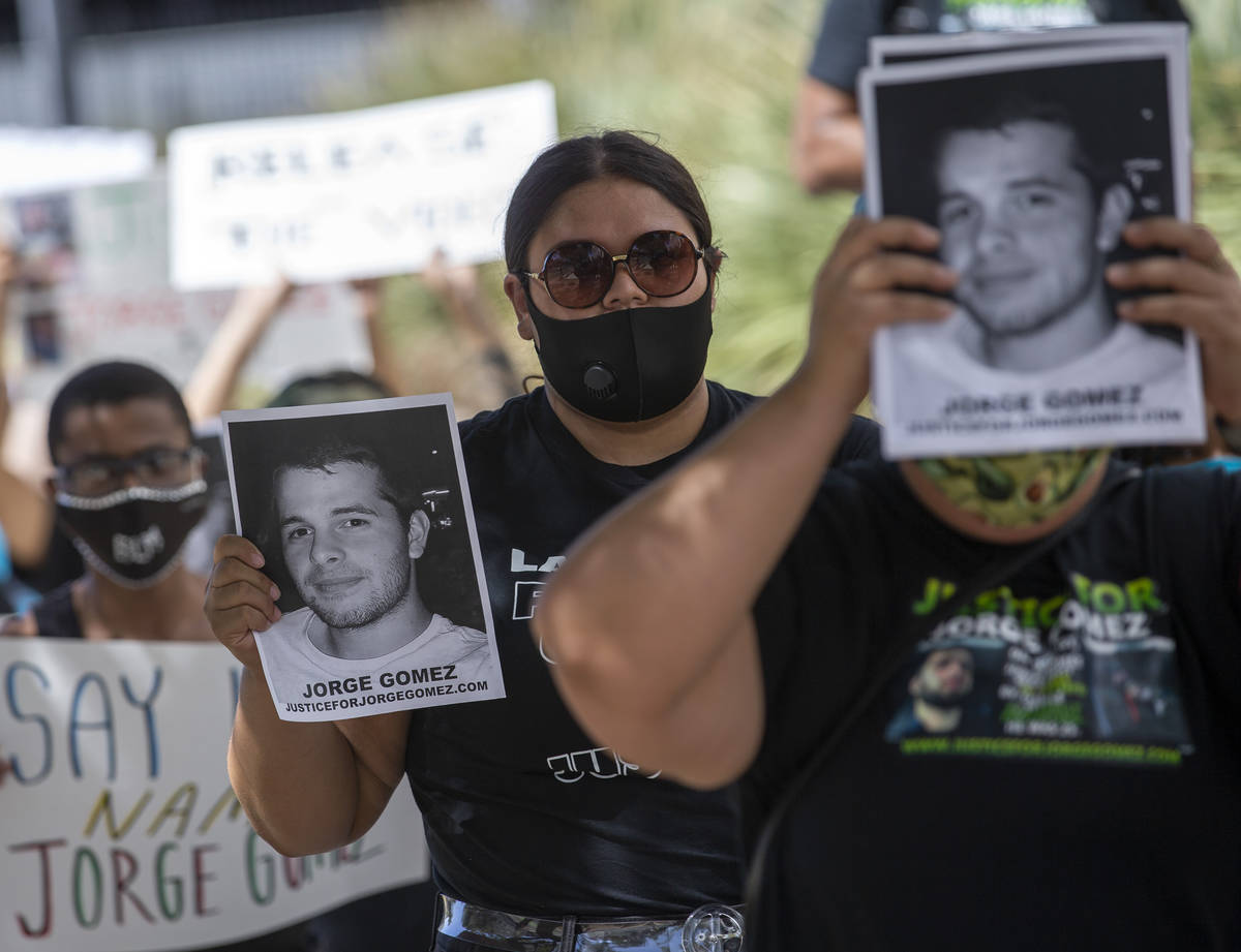 Ariah Justin, center, participates in a march on Wednesday, July 22, 2020, in Las Vegas, for Jo ...