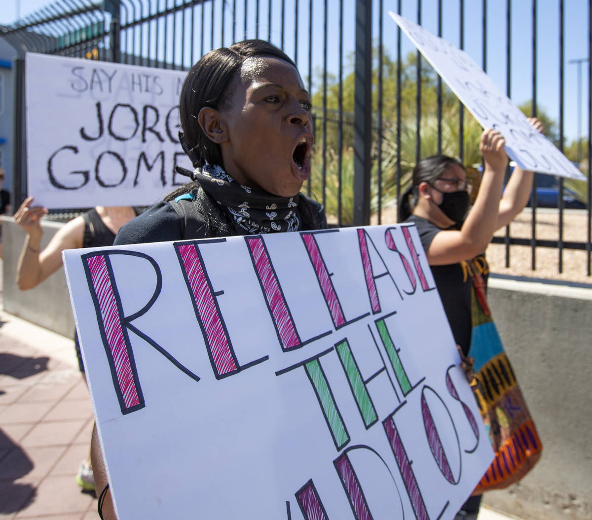 Teresa Brooks, center, chants "no justice, no peace," Wednesday, July 22, 2020, as a group marc ...