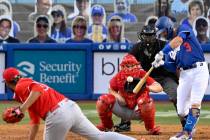 Los Angeles Dodgers' Chris Taylor, right, hits a three-run home run as Los Angeles Angels pitch ...