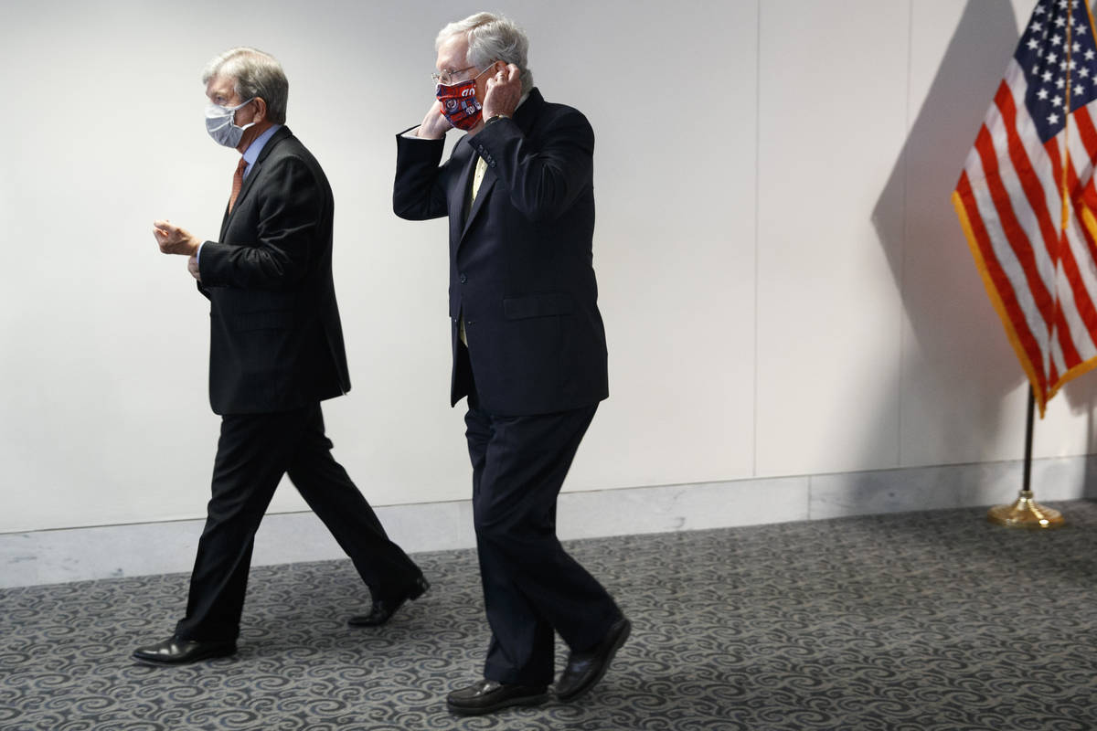Sen. Roy Blunt, R-Mo., left, and Senate Majority Leader Mitch McConnell of Ky., leave a news co ...