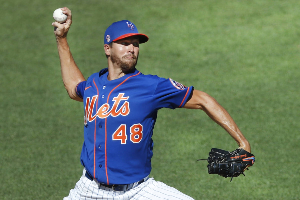 New York Mets starting pitcher Jacob deGrom (48) winds up while delivering a pitch during a sim ...