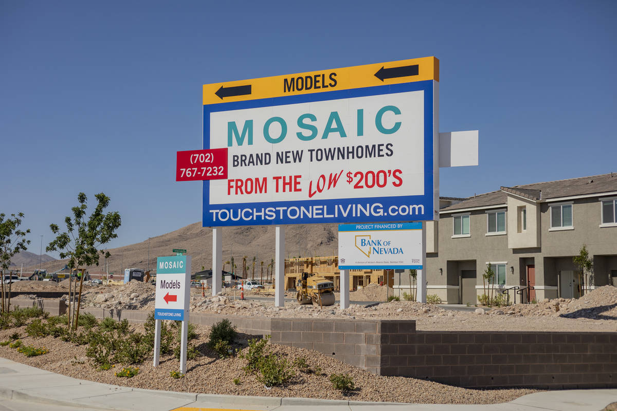 A sign advertising models of the Mosaic townhome community is seen, located south of the Las Ve ...