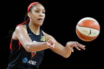 Las Vegas Aces' A'ja Wilson passes against the Washington Mystics during the first half of Game ...