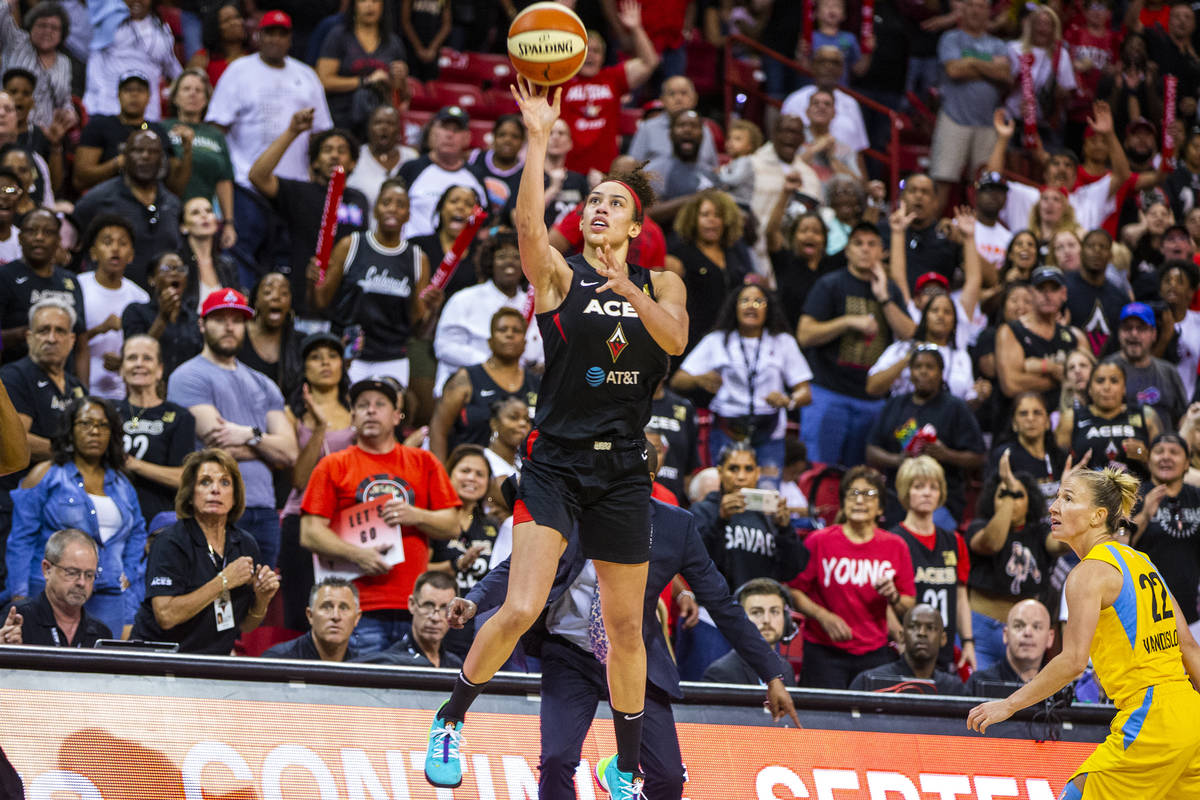 Las Vegas Aces forward Dearica Hamby (5) makes a late-game three-point-shot over the Chicago Sk ...