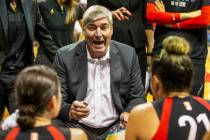 Las Vegas Aces head coach Bill Laimbeer talks up his players in a huddle during a timeout as th ...