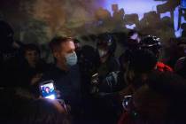 Portland Mayor Ted Wheeler wades through the large crowd, where his stated goal was to conduct ...